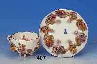 Mokkatasse mit Untertasse, Meissen, um 1880/ 90, Porzellan, applizierter Blumendekor, Goldstaffage, min. best., auf Füsschen ste- hend, H. ...