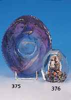 PAPERWEIGHT, BöHMEN, UM 1910, FARBLOSES GLAS MIT EINGESCHMOLZENER KINDERFOTOGRAPHIE UND BUNTEN GLASTEILEN, FACETTIERT, H. CA. 11 CM