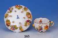 Mokkatasse mit Untertasse, Meissen, um1870, Porzellan, applizierter Blumendekor, auf je- sechs Fsschen stehend, sehr sch”ne Bemalung, min. an ...