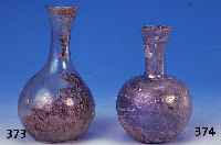 Flasche, r”misch, ca. 2.-3. Jh. n. Chr., Glas, mit ausgezogenen Noppen, lstriert, Bodenfund, daher alte Erdverkrustungen, H. ca. 13.5 ...