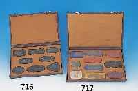 Sammlung aus 8 Tuschesteinen, China, um 1900- 1910, fein reliefiert und partiell bunt bemalt, im orig. Etui