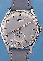 LONGINES HERRENARMBANDUHR, REF.-NR. 7035- 3/558, SCHWEIZ CA. 1955, EDELST., BODEN UND GLASRAND AUFGEDR., BLATT REST., KL. SEK. VERT., ...