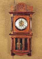 Wanduhr, Kienzle, um 1910/20, verziertes Holzgehäuse, Originalaufsatz, Schwungbereich des Pendels facett. verglast, ...