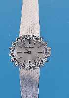 LONGINES Damenarmbanduhr, neutr. WG 750/000-Geh. incl. WG-Milanaiseband, Lünette m. 40 8/8Diamanten zus. ca. 0,4 ct feines Weiß, Boden gedr., ...