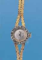 ONIF Damengoldbanduhr, GG 750/000-Geh. incl.GG-Band, Boden gedr., Lünette m. 20 8/8 Dia- manten in WG gef. zus. ca. 0,3 ct l. get. WeißBoden ...