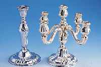 Konvolut 2 Kerzenleuchter, deutsch, 30er Jahre, Barockstil, 1 x 5-flammig, 925er Silber, Anlaufschutz besch., H ca. 27 cm, D ca. 27 cm; ...