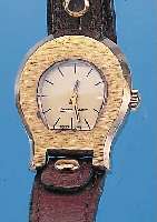 ETIENNE AIGNER DAMENARMBANDUHR, SCHWEIZ UM 1975, METALL HARTVERG., EDELST.-BODEN GEDR., TYP. DESIGNERMODELL M. ORIG.-LEDERBAND, ZIFFERBL. SIGN., ...