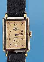 GUB HERRENARMBANDUHR, REF.-NR. 80901, DEUTSCHL. UM 1953, METALL NACHVERG., EDELST.- BOD. AUFGEDR., IN SICH L. GEWöLBT, RECTANG.- FORM, VERS. ...