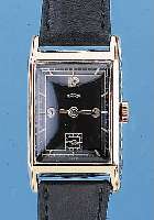 BERG HERRENARMBANDUHR, GG 585/000, SCHWEIZ/ DEUTSCHLAND UM 1938, RECT.-FORM, SEITL. SCHMUCKGEPR., SCHARNIERB., BLATT REST., TONNENFöRM. ...