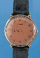 IWC Herrenarmbanduhr, Schweiz um 1951, GG 750/000, D. ca. 36 mm, kupferfarb. Blatt, Boden u. Glasr. gedr., Kal. 89, Handaufzug, Werk-Nr. ...