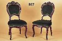 Drei Stühle, Frankreich, um 1830-40, Mahagoni, am Giebel reich floral geschnitzt, H./Sh. 95/45 cm, einer mit alter Restaurierung