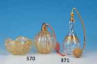 ZWEITEILIGES TOILETTENSET, MURANO, 30/40ER J., BEST. AUS PARFUMZERSTäUBER U. SCHäLCHEN, FARBLOSES GLAS, EINGESTOCHENE LUFTBLASEN U. ...