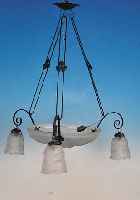 DECKENLAMPE, FRANKREICH, 20/30ER JAHRE, SCHIRME AUS REICH RELIEFIERTEM FARBLOSEM PRESSGLAS, MONTUR SCHMIEDEEISERN, H. CA. 60 CM, D. ...