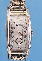 GRUEN HERRENARMBANDUHR CURVEX, REF.-NR. 501-296, SCHWEIZ/USA UM 1938, GG-FILLED, BODENEDELST., GEZ. TONNENF., IN SICH GEW., M. CA. 46 X 21 MM, ...