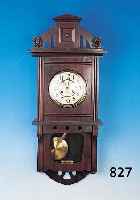 WANDUHR, JUNGHANS, UM 1920/25 VERZIERTES HOLZ-GEHäUSE IM ZEITTYPISCHEN STIL, SCHWUNGBEREICH DES PENDELS VERGLAST, ORGINALAUFSATZ, ZWEIGE- TEILTES ...