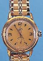 GLASHÜTTE HERRENARMBANDUHR, REF.-NR. 57935, DEUTSCHLAND UM 1954, METALL VERG., BER., EDEL-ST.-BODEN GESCHR., ORIG.-BLATT ALTERSBED. FARBL. ...