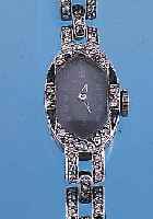 DAMENARMBANDUHR ART DECO, REF.-NR. 322320, PLATIN, LüNETTE U. SCHARNIERBANDANST. M. ALT- SCHLIFFDIAMANTEN U. SAPHIR-BES. (2 DIAM. FEH- LEN), BODEN ...