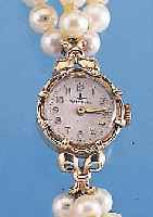 DUGENA DAMENARMBANDUHR, REF.-NR. 41802, SCHWEIZ/DEUTSCHLAND UM 1949, GG 585/000-GEH. INCL. GG-FALTSCHL., DREIREIHIGES ZUCHTPERLEN- BAND, ...