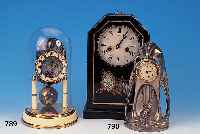 KONV. AUS ZWEI TISCHUHREN, JUNGHANS UM 1910/ 20, KL. TISCHUHR JUGENSTIL, IM SOCKEL EINE UHR AUFZIEHENDER PUTTO, EINSTECKWERK, STIFTEN-ANKERGANG, ...