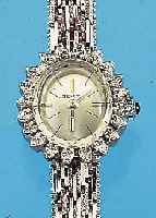 ZENITH DAMENGOLDBANDUHR, SCHWEIZ UM 1970, WG 750/000-GEH. INCL. WG-GLIEDERB. RODH., SCHMUCKKRONE, AUFWEND. LüNETTE M. 20 8/8 DIA- MANTEN ZUS. ...
