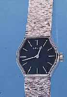 LONGINES DAMENGOLDBANDUHR, REF.-NR. 5/10/ 4523, SCHWEIZ UM 1974, WG 750/000-GEH. INCL. WG-BAND RODH., MINERALFLACHGL., BODEN GEDR., FORMANKERW., ...