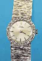 GIRARD PERREGAUX DAMENGOLDBANDUHR, SCHWEIZ UM 1965, NEUTR. WG 750/000-GEH. RODH. INCL. WG-GLIEDERB., AUFWEND. LüNETTE M. 26 8/8 DIA- MANTEN ZUS. ...