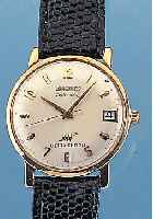 LONGINES HERRENARMBANDUHR ULTRACHRON, REF.- NR. 69-556, SCHWEIZ UM 1964, METALL M. GG- AUFLAGE, EINSCHALENAUSF., BODEN M. WIDMUNGS- GRAV., GET. ...