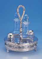 MENAGERE, 925ER SILBER, DURCHBRUCHARBEIT, MIT 2 KARAFFEN, SALZ UND PFEFFERSTREUER, AUF 3 FüßEN, H CA. 26 CM, D CA. 18 CM, SILBERGEW. ...