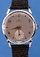 OMEGA HERRENARMBANDUHR, REF.-NR. 2612-4, SCHWEIZ UM 1952, EDELST., BODEN U. GLASR. GE- DR., VERS. BLATT FL., VERG. ANKERW., 15 ST., ...