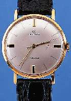 GOLANA HERRENARMBANDUHR, REF.-NR. 5249, SCHWEIZ UM 1962, GG 585/000, GLASR. GEDR., FLACHE AUSF., VERS. BLATT, 17 ST., HANDAUFZUG-KAL. VON FHF ...