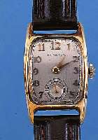 HAMILTON HERRENARMBANDUHR, REF.-NR. P470382,USA UM 1942, GG-FILLED, TONNENFORM, BODEN GE- DR., IN SICH GEW., VERS. ORIG.-BLATT, AUFGES. ...