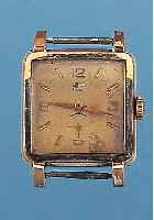 GUB HERRENARMBANDUHR, DEUTSCHLAND UM 1955, METALL VERG. BER., EDELST.-BODEN GEDR., VERS. BLATT FL., FORMANKERW., BAUWEISE RAUMNUTZWERK,15 ST., KAL. ...