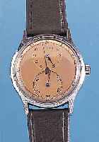 FHF HERRENARMBANDUHR REGULATOR, REF.-NR. 11293, SCHWEIZ UM 1940, METALL VERCHR., EDELST.-BODEN GEDR., KUPFERFARB. BLATT, TYP. ...