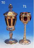 DECKELPOKAL, WOHL BöHMEN, 19 JH., FARBLOSES GLAS, PART. RUBINIERT, FACETTIERT, GESCHNIT- TEN U. GESCHLIFFEN, REICHE GOLDSTAFFAGE, H. CA. 23 CM