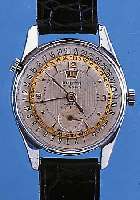 URBITA HERRENARMBANDUHR, REF.-NR. 914, SCHWEIZ UM 1950, METALL VERCHR., EDELST.-BODENGESCHR., SELTENE VOLLKALENDERANZ. AUßER MOND- PHASE, ...