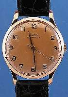 DOXA HERRENARMBANDUHR ANTIMAGNETIC, REF.-NR.938374, SCHWEIZ UM 1945, RG 585/000, D. CA. 37 MM, ORIG.-BLATT ALTERSBED. L. FARBL. GET., BODEN U. ...