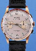 PRECIMAX ARMBANDCHRONOGRAPH, REF.-NR. 187, SCHWEIZ UM 1949, RG 750/000, BODEN U. GLASR. GEDR., METALLCUV. ZUR ARMIERUNG, BLATT REST., ...