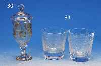 POKALGLAS, BöHMEN, WOHL 20/30ER JAHRE, FARBLOSES GLAS, FACETTIERT, PART. GELB GE- BEIZT, IN KLEINEN KARTUSCHEN DARST. VON WILD U. ...