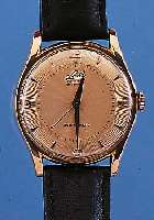 SULLY HERRENARMBANDUHR DELUXE, REF.-NR. 1004, SCHWEIZ UM 1955, RG 750/000, AUFWEND. GUILL. ORIG.-BLATT, BODEN GEDR., INNENSCH. GEGEN ...
