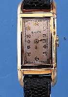GRUEN HERRENARMBANDUHR, SCHWEIZ/USA UM 1938,METALL M. GG-AUFLAGE, EDELST.-BODEN GEDR., IN SICH GEW., RECT.-FORM, LEDERB. NEU, OHNE SEK., ...