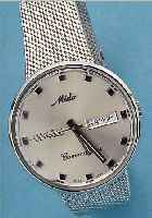 MIDO HERRENARMBANDUHR COMMANDER, REF.-NR. 636-8429, SCHWEIZ UM 1995, EDELST.-EINSCHALEN-GEH., EDELST.-FLECHTBAND, STILTYP. UM 1964, ORIG.-ETUI, ...