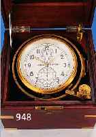 MARINE-CHRONOMETER "KIROW", UM 1960, DREITEILIGER VERGLASTER EDELHOLZKASTEN MIT MESSINGMONTUREN, VERSILBERTES ZIFFERBLATT MIT ...