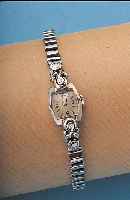 OMEGA DAMENARMBANDUHR, REF.-NR. 7525, SCHWEIZ UM 1957, WG 585/000, AN DEN KORDEL- BANDANST. JEWEILS 1 8/8 DIAMANT, EDELST.-ZUG- GLIEDERBAND ...