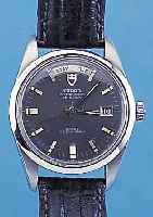 TUDOR HERRENARMBANDUHR DATE-DAY, REF.-NR. 682304/3017/0, SCHWEIZ UM 1969, EDELST., GEH. BAUWEISE ROLEX, BODEN U. KRONE GESCHR., ETUI, NEUTR. ...
