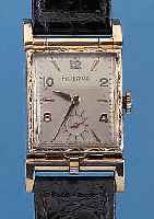 BULOVA HERRENARMBANDUHR SOGENANNTE PICTURES- WATCH, WERK M. ÜBERGEH. AUFKLAPPBAR, DARUN- TER RAHMEN ZUM EINLEGEN EINES FOTOS, USA UM 1942, ...