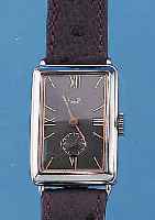 ARCTOS ELITE HERRENARMBANDUHR, DEUTSCHLAND UM 1936, EDELST., RECT.-FORM, BODEN GEDR., IN SICH L. GEW., ORIG. 2-FARB. BLATT (CU-FARB.U. SCHW.), ...