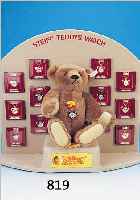 GR. PRäSENTATIONSDISPLAY, STEIFF TEDDYS WATCH 1993, 12 STEIFF-UHREN IN FORM VON BäREN- KöPFCHEN, IN VERSCHIED. AUSFüHRUNGEN AN KETTE,IN DER ...