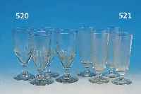 NEUN POKALGLäSER, UM 1890, FARBL. GLAS, IN DIE FORM GEBLASEN, GESCHNITTENER DEKOR, H. JE CA. 17 CM, 2 X AM FUß BESTOßEN