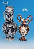 HENKELVASE, THURN & TEPLITZ, UM 1880/90, STEINZEUG, REICH RELIEFIERTER KORPUS IN FLO- RALEM DEKOR, BUNT BEMALT, GOLDSTAFFIERT, H. CA. 32 CM