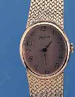 GLASHÜTTE HERRENARMBANDUHR, UNGETR. LAGERW.,UM 1985, METALLGEH. HARTVERG. INCL. BAND,EDEL-ST.-BODEN GEDR., EMAILFARB. ...